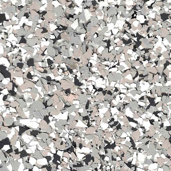 The image shows a chaotic collection of irregularly shaped, multi-colored fragments densely packed together to form a textured, abstract surface. Shades of grey, white, and black dominate.