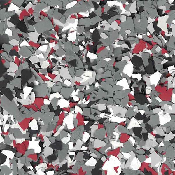 The image shows an abstract pattern of scattered, irregular shapes in shades of red, white, and gray, resembling a pile of fragmented, colored pieces.