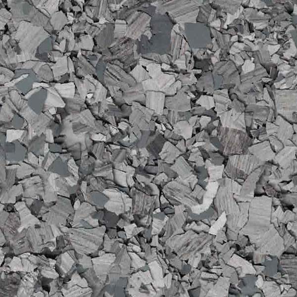 The image displays a jumbled collection of grayish rocks or stone fragments with varying shades and flat surfaces, densely packed together.