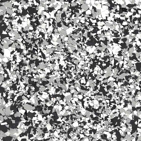 The image shows a chaotic arrangement of many irregular, angular shapes predominantly in grayscale, creating a textured, abstract, mosaic-like appearance or pattern.