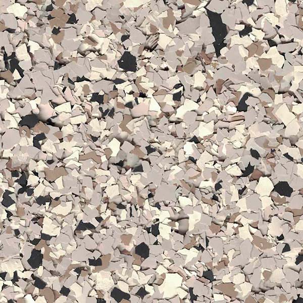 This image depicts a speckled pattern of broken or shattered pieces in varying shades of beige, black, and white, resembling a textured surface or abstract design.