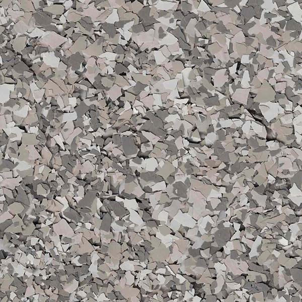 The image shows a close-up texture resembling a surface of fragmented stones in various shades of grey, white, and muted beige, creating a mosaic effect.